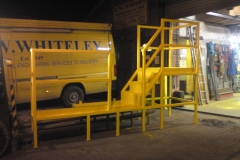 Work platform with safety barrier & kick plate to conform with safety regulations